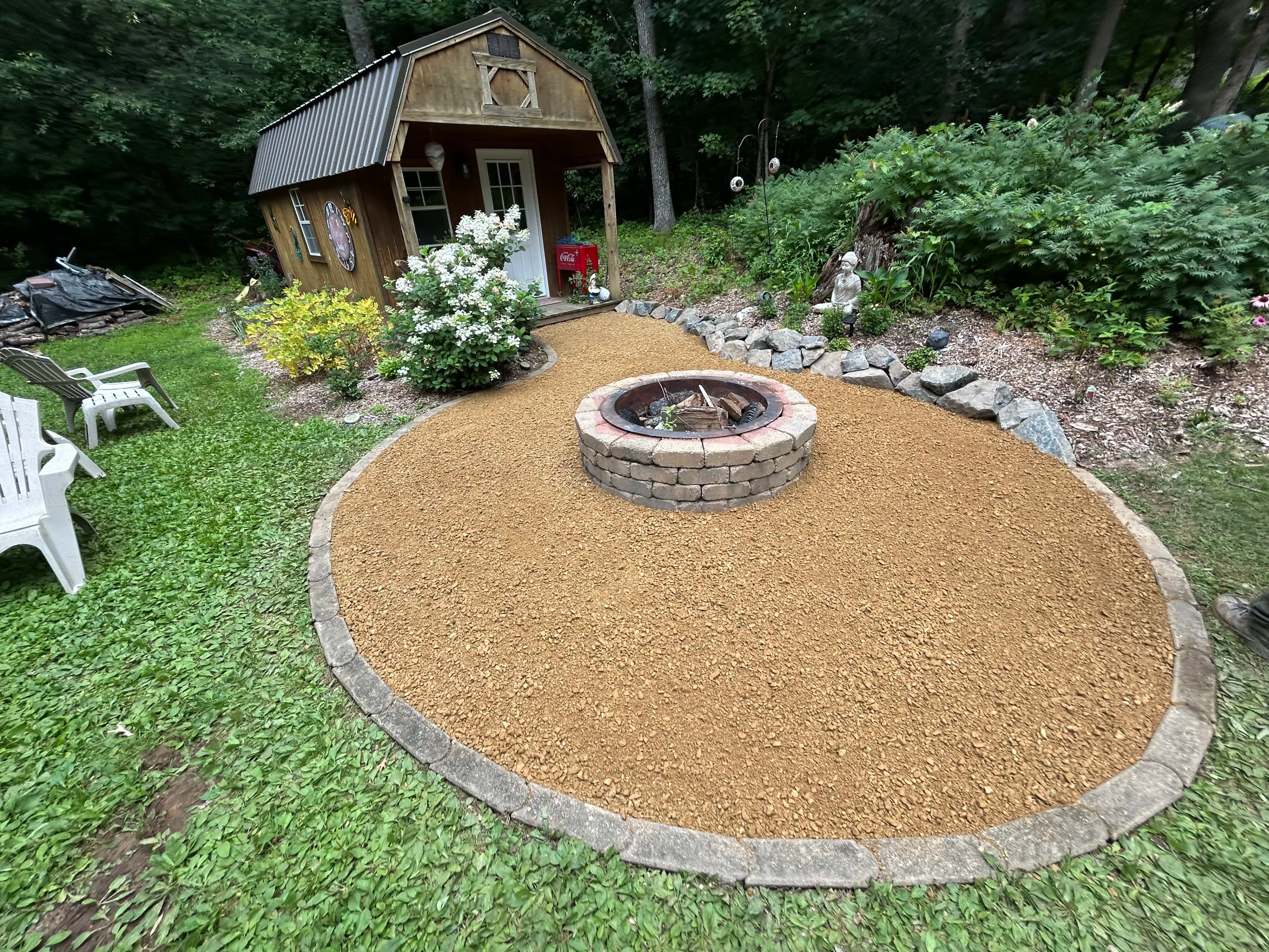 Project Fire Pit Area Facelift with Blue Granite Boulders and Fresh Gravel image