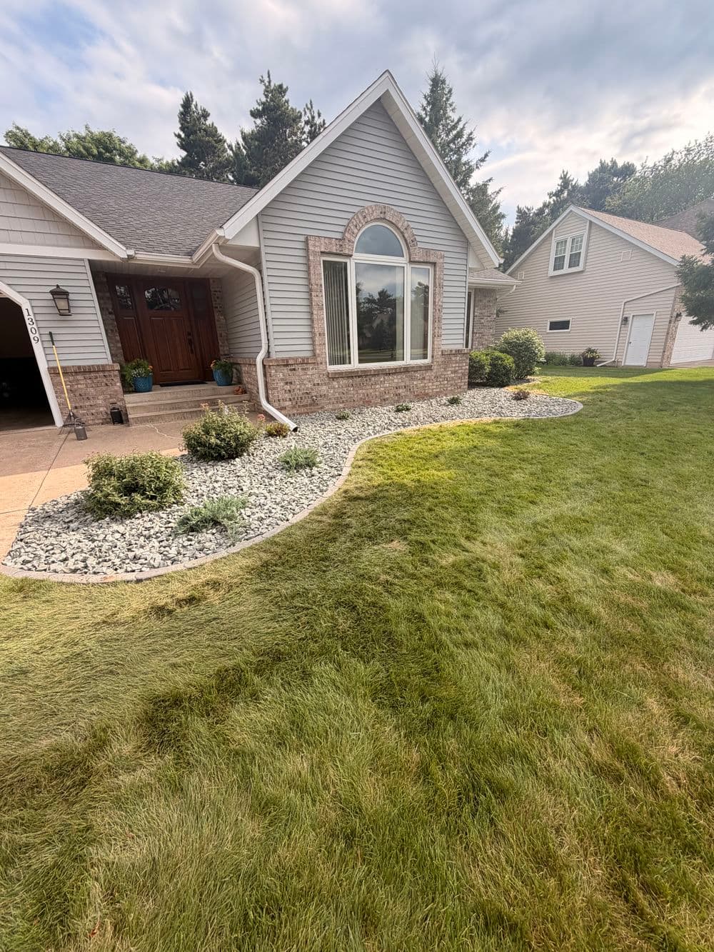 Garden Bed Repair with Blue Granite Stone and Concrete Edgers image