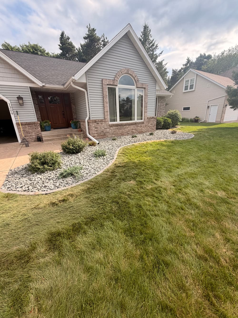 Project Garden Bed Repair with Blue Granite Stone and Concrete Edgers image