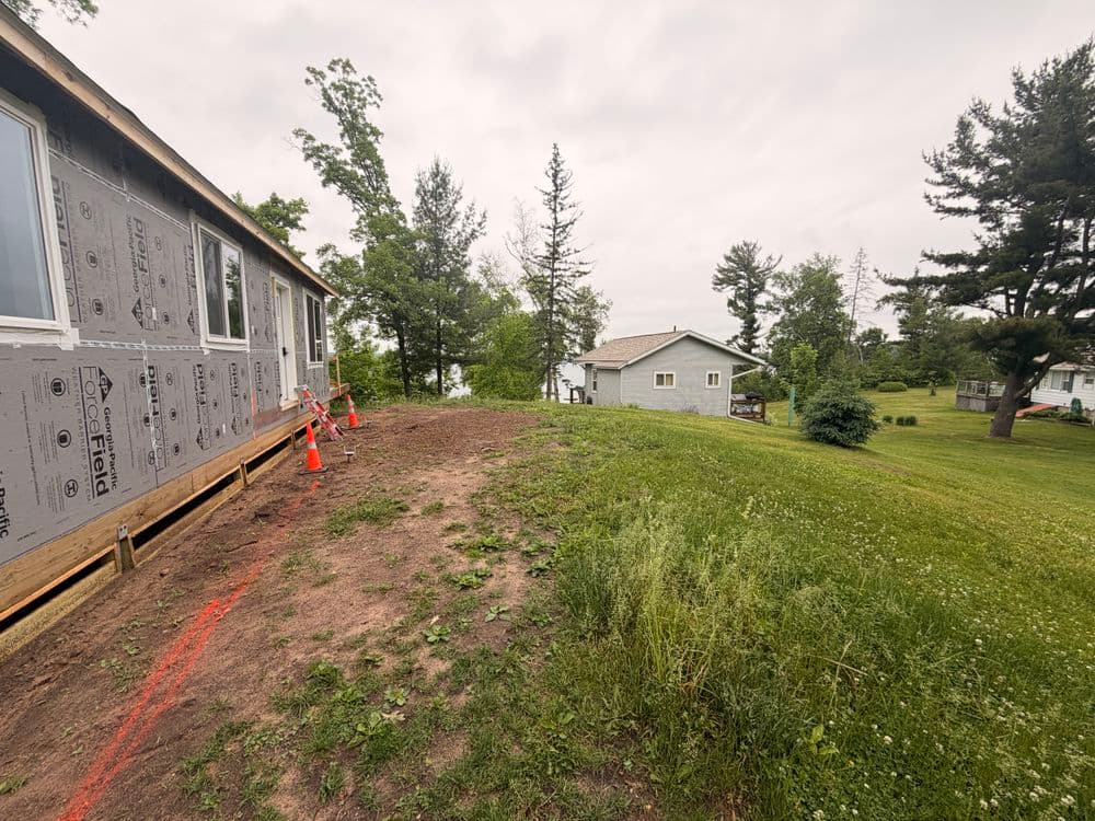 Gallery photos for Full Landscaping Overhaul with Boulder Walls and Gravel Driveway in Luck, WI: Image #1